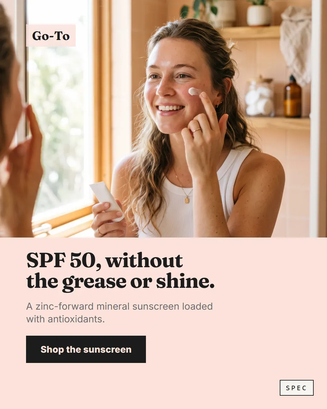 Spec concept for Go-To (unaffiliated, not commissioned): woman applying mineral sunscreen by a window, headline SPF 50, without the grease or shine.